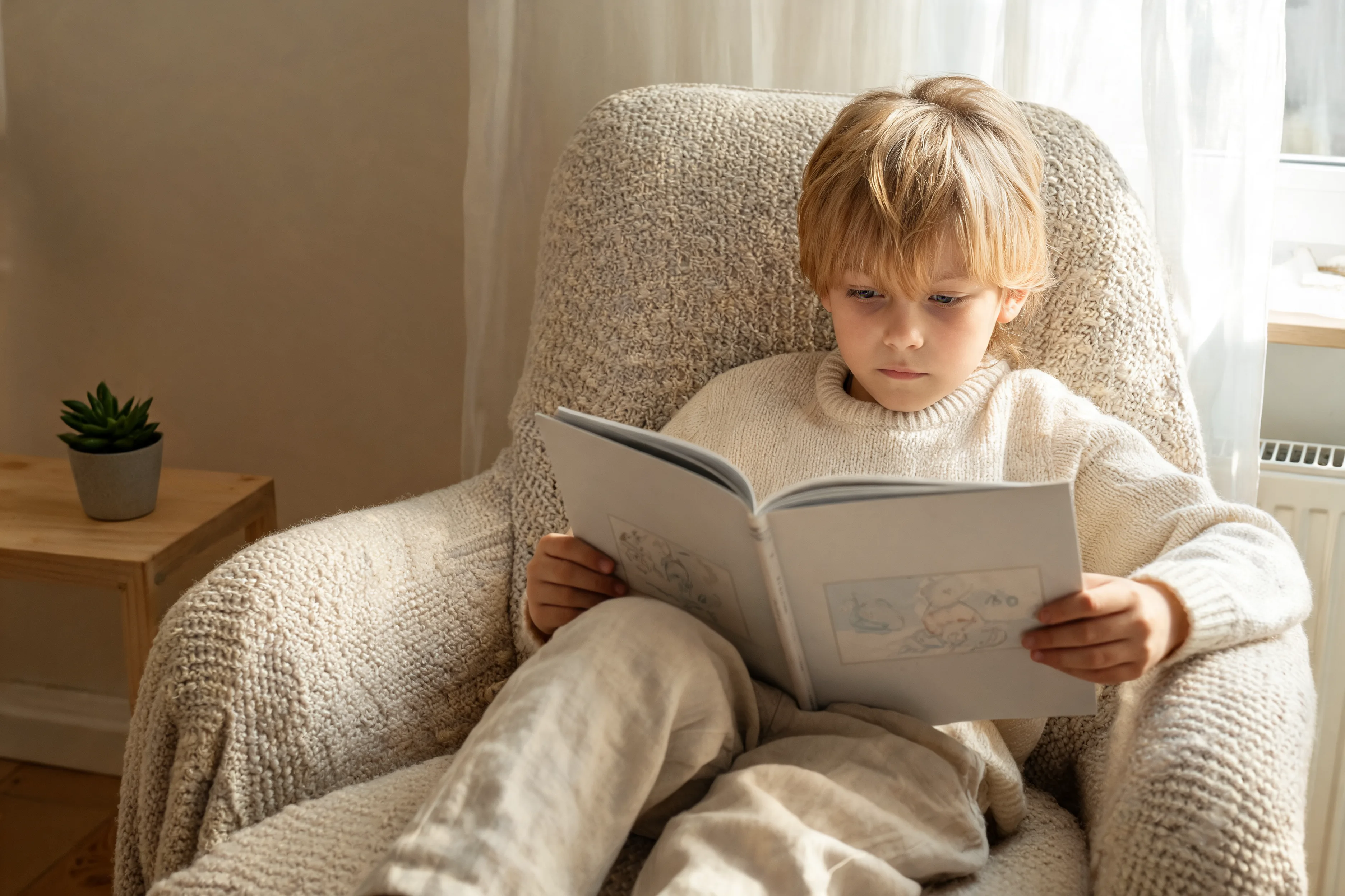 Reading builds a child's confidence Child reading independently with calm focus, showing the confidence that grows through regular reading